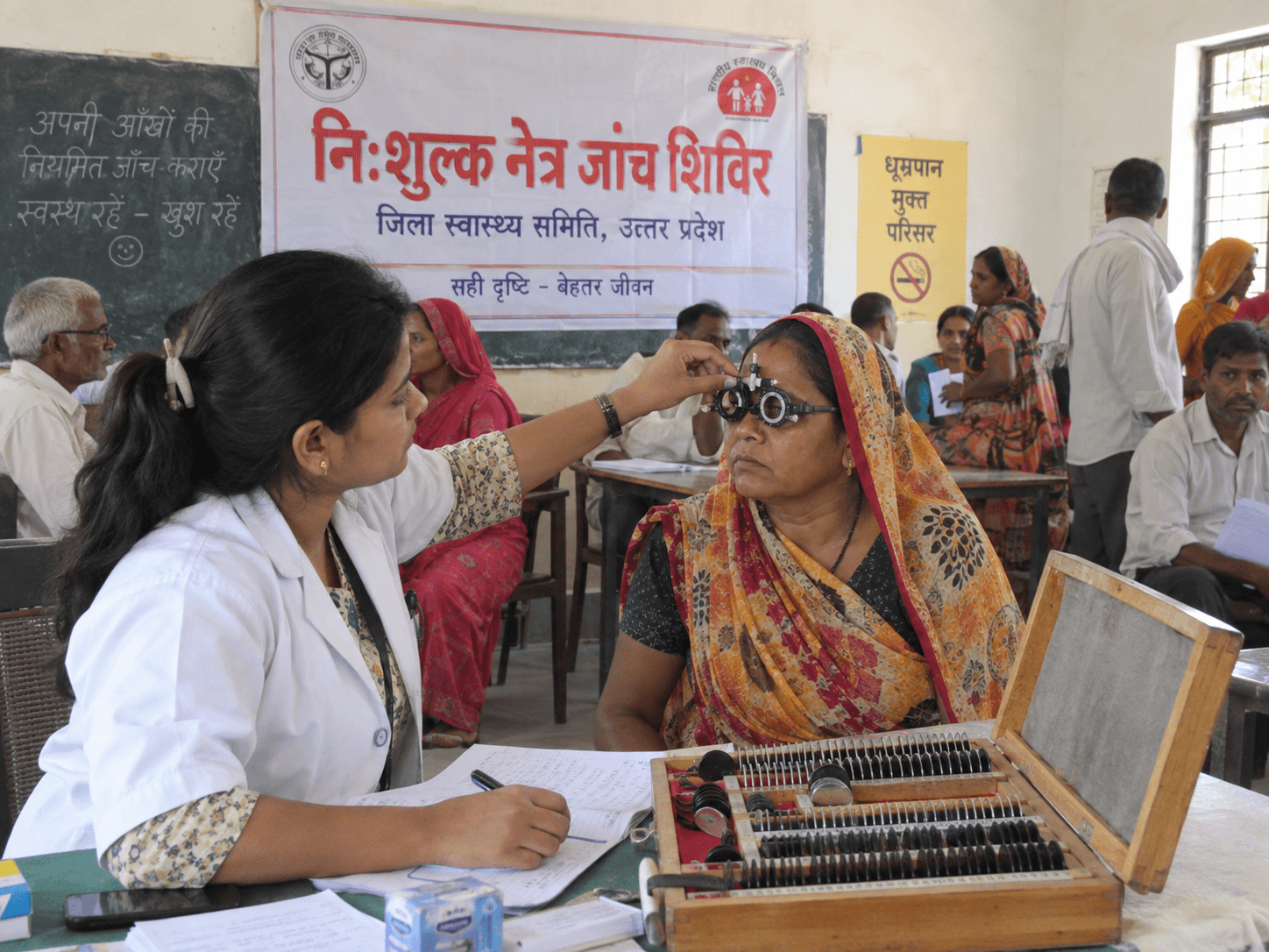 A patient receiving an eye examination during a community medical camp