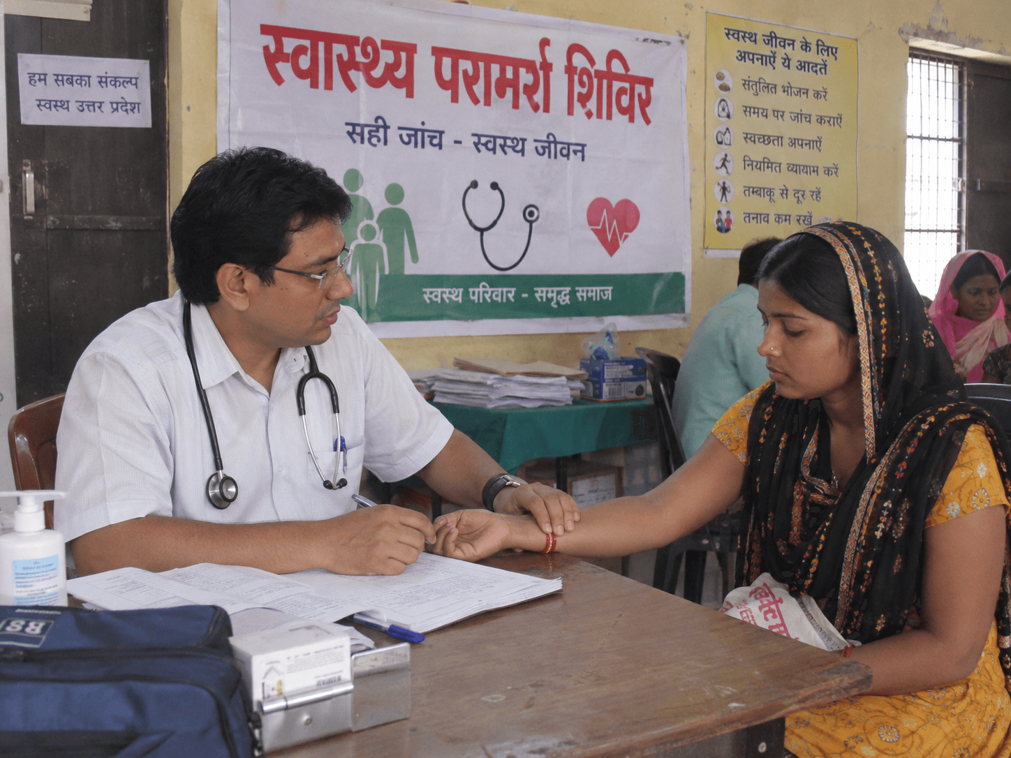 A patient receiving preventive health screening at a medical camp